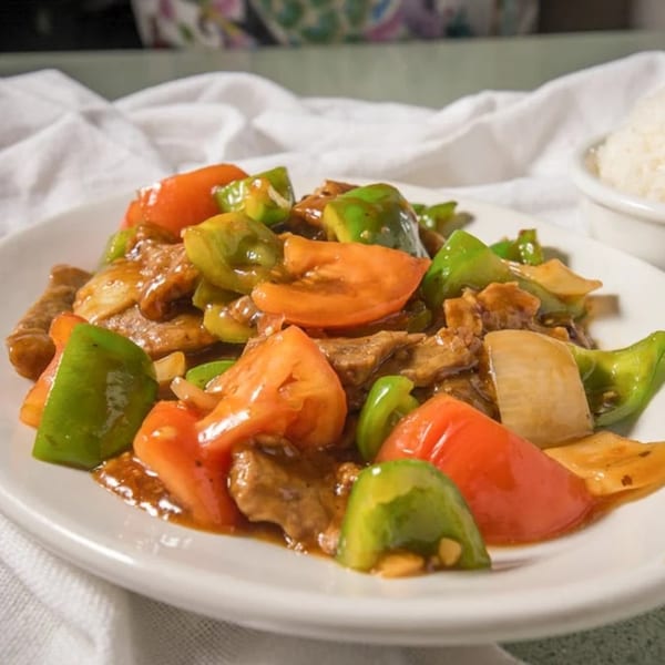 D. Fong's Chinese Cuisine's beef and bell pepper stir-fry with tomatoes and onions, served with rice.