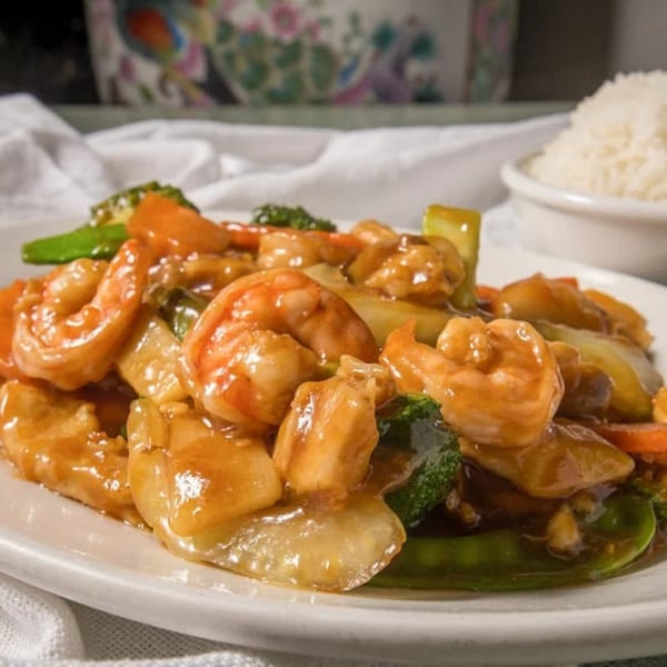 D. Fong's Chinese Cuisine's shrimp and chicken stir-fry with vegetables and a side of white rice.